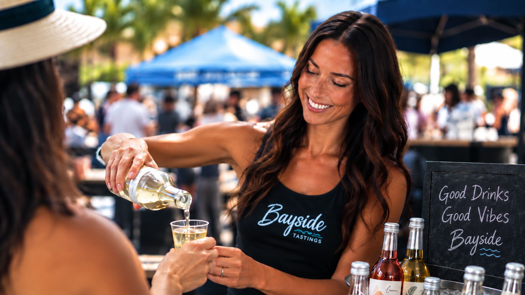 Bayside brand ambassador pouring a tasting sample at an outdoor activation